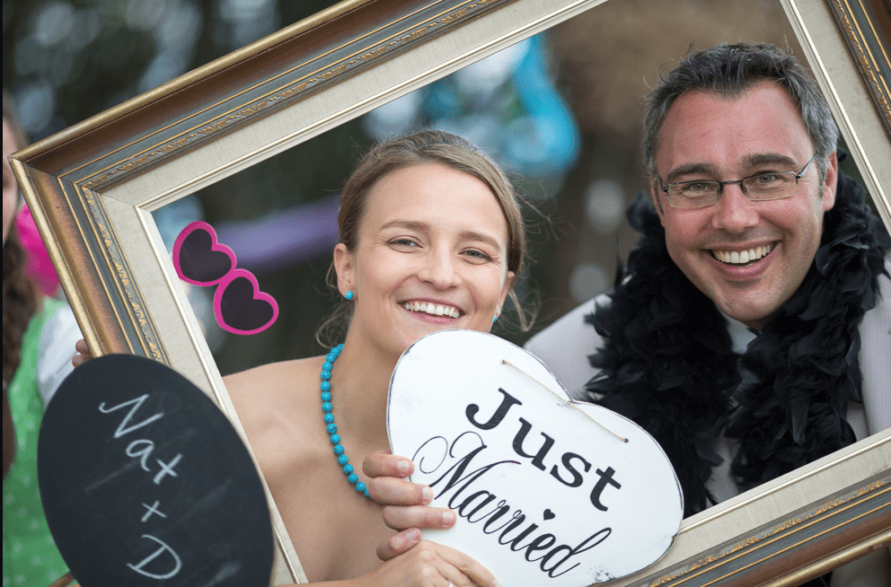 couple holding a 'just married' sign