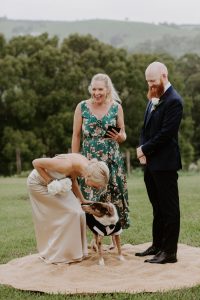 Couple about to be married with dog as best man, and Heidi Robertson Celebrant and MC, Byron Bay