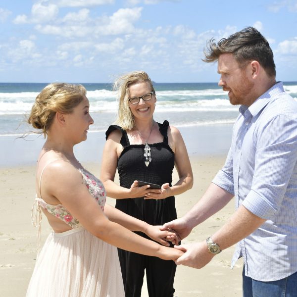 couple saying vows on the beach in Byron Bay