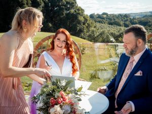 Northern rivers celebrant Signing marriage certificate at Nutting Hill Villa, Clunes