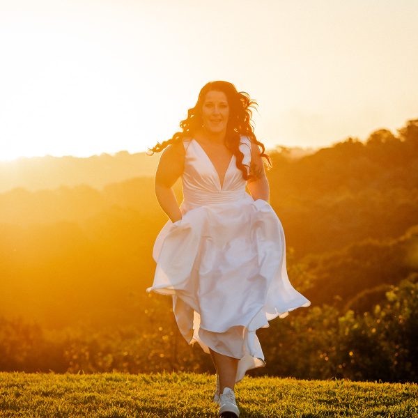 Bride running towards camera