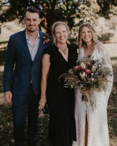 Heidi Robertson, Celebrant and MC, with couple just married on a farm