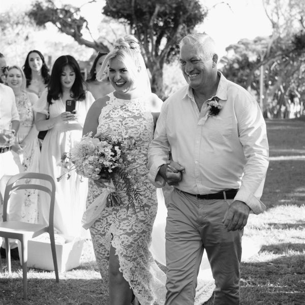 bride walking down aisle with her father